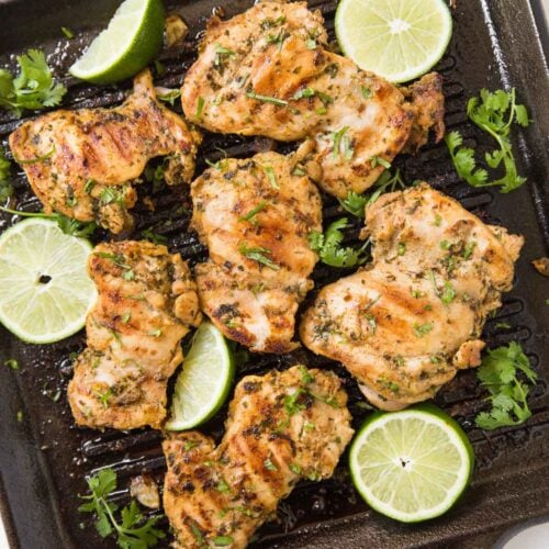 Prepare these cilantro lime grilled chicken thighs with delicious and healthy marinade. A quick and easy prep-ahead recipe perfect for a grilling party. Or just cook marinated chicken on the grill or frying pan for the weeknight dinner. | #watchwhatueat #grilledchicken #cilantrolime #grilling #chickenthighs