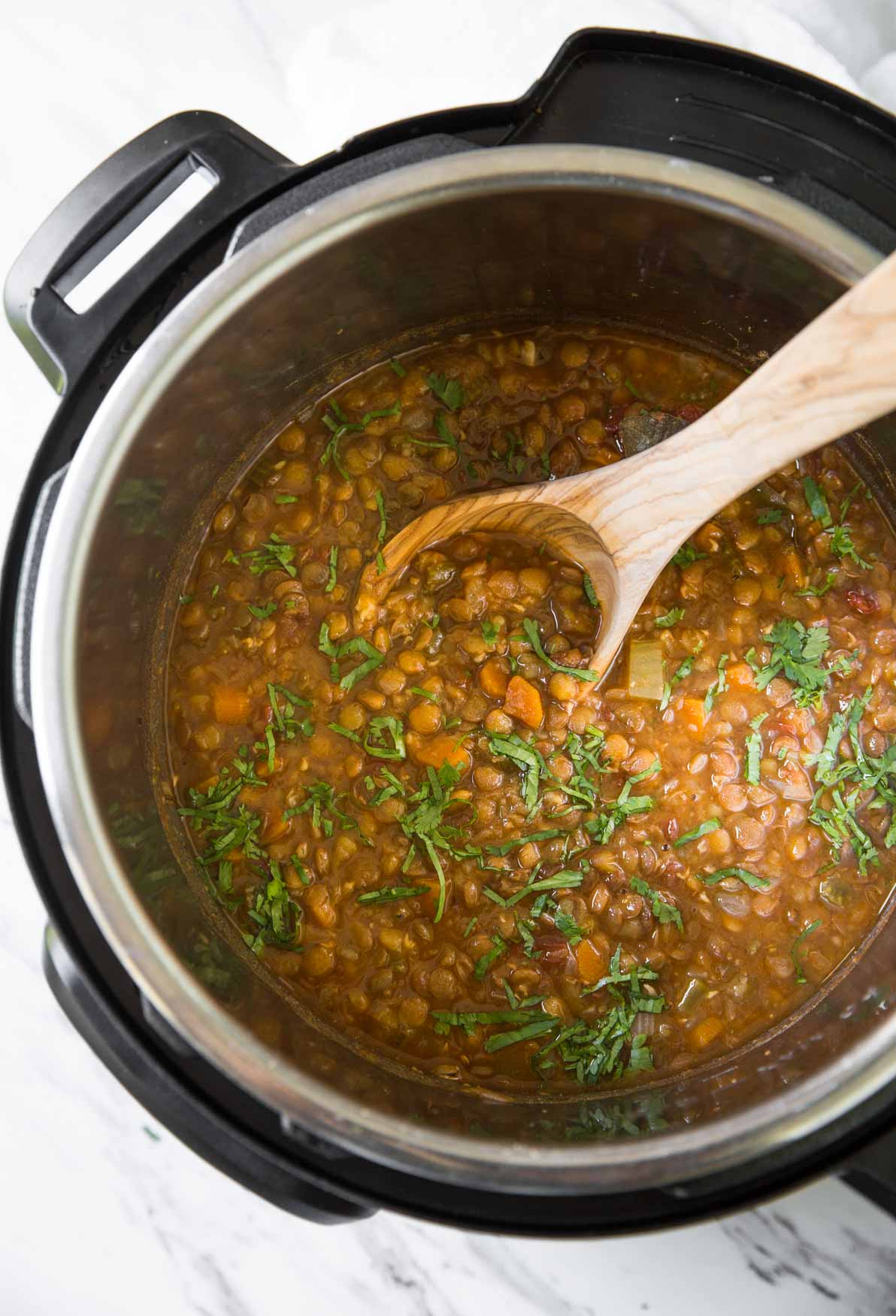 Make this healthy vegan lentil soup in an Instant Pot for a quick, easy and a satisfying meal. It is packed with proteins & tempting flavors which you will love to make again and again. | #watchwhatueat #ad #VegetarianBTB, #IC #instantpot #lentilsoup