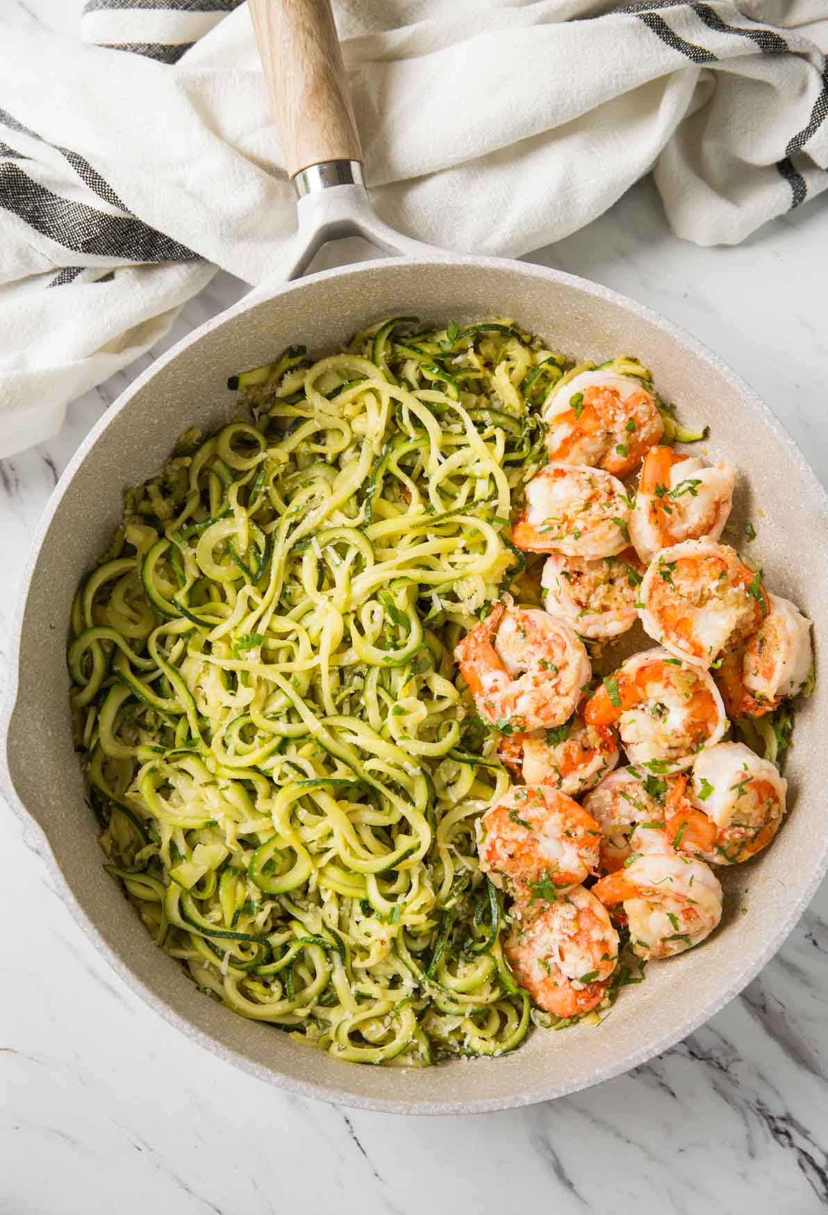 Shrimps and zucchini noodles cooked in fresh garlic and lemon juice and topped with finely chopped fresh herbs.