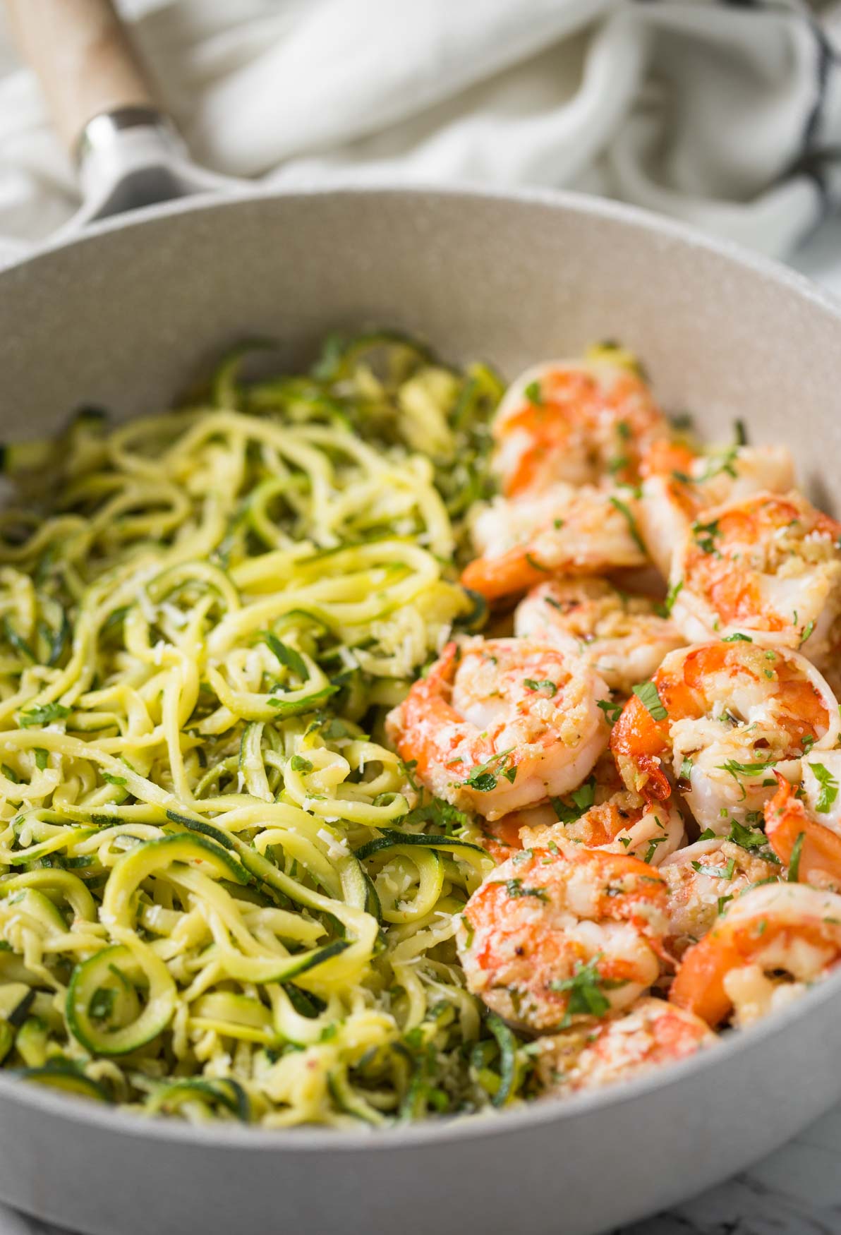 Shrimps and zucchini noodles cooked in fresh garlic and lemon juice and topped with finely chopped fresh herbs.