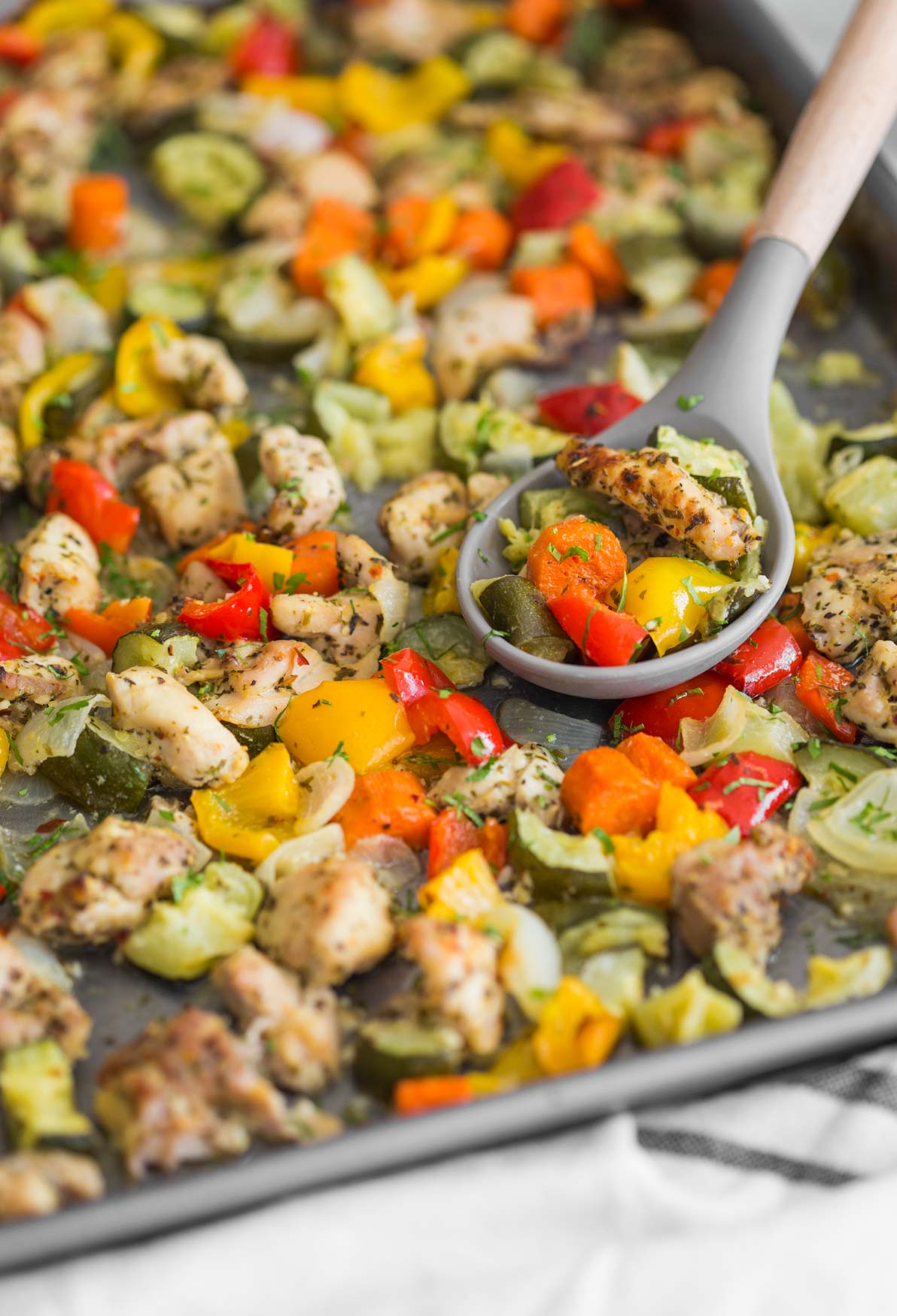 One-pan baked chicken and vegetables in a baking tray ready to serve