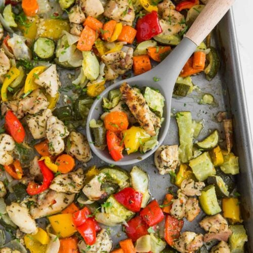 One-pan baked chicken and vegetables in a baking tray ready to serve