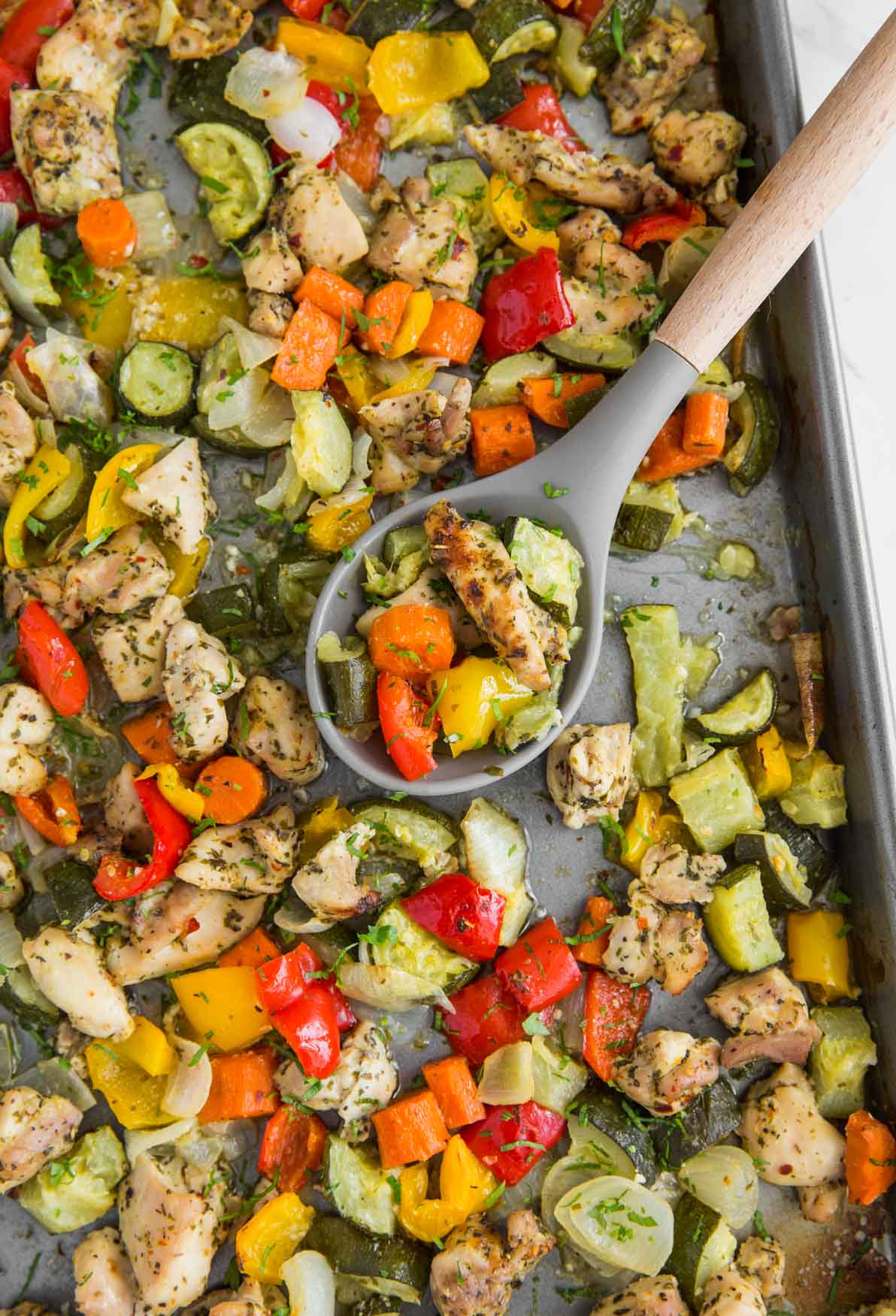 One-pan baked chicken and vegetables in a baking tray ready to serve