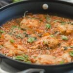 garlic basil chicken with tomato sauce in a large skillet