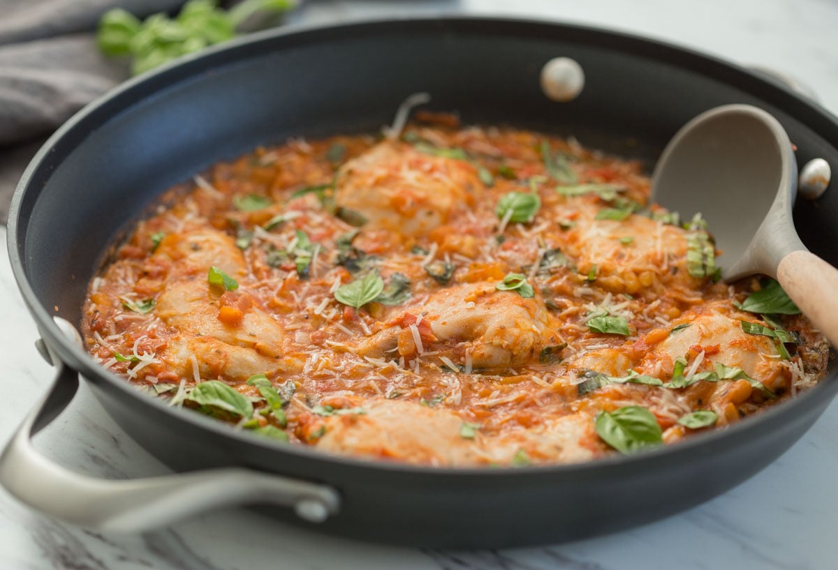 Garlic basil chicken with a delicious tomato sauce in a large skillet.