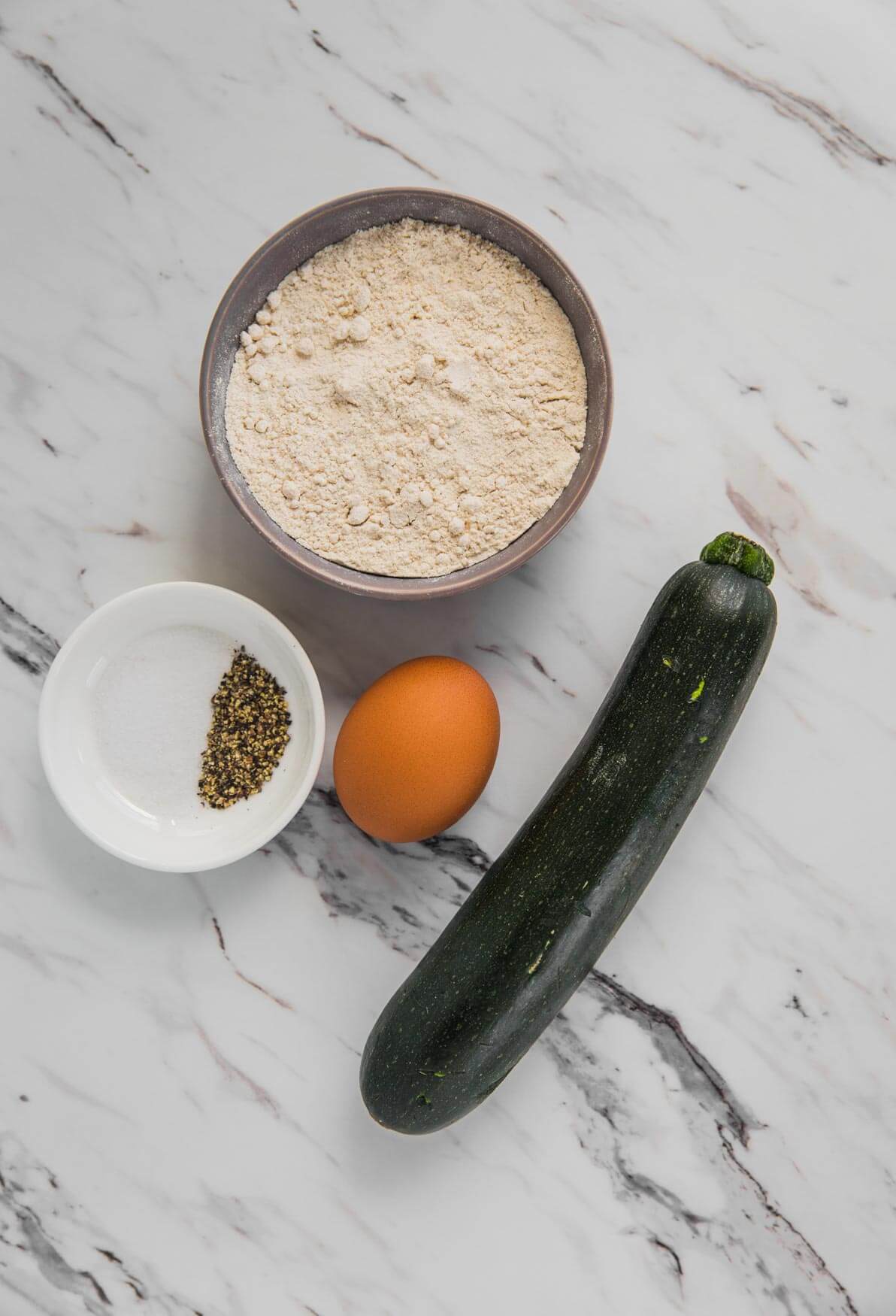 Ingredients for making healthy zucchini pancakes