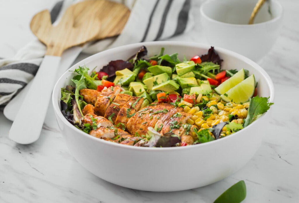 Mexican Salad with chicken and avocado in salad bowl