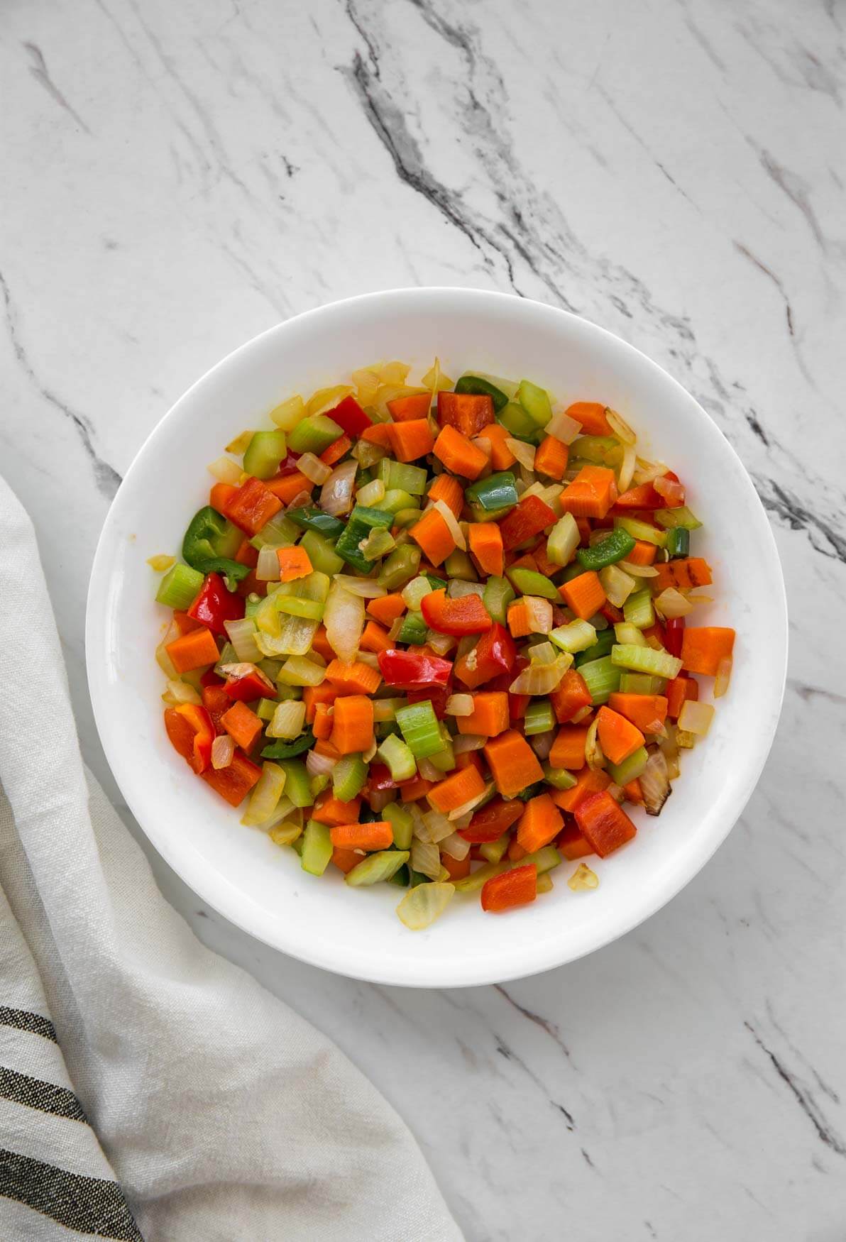 image of sautรฉed vegetables in a plate for making lemon orzo chicken soup