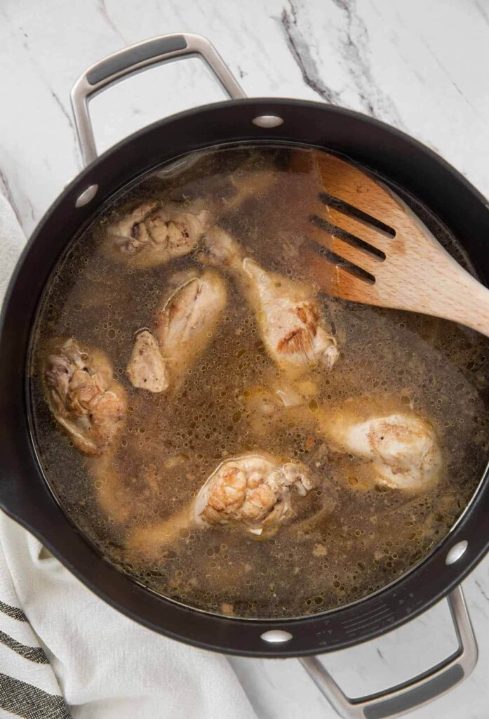 chicken drumstick broth prepared in a large pot