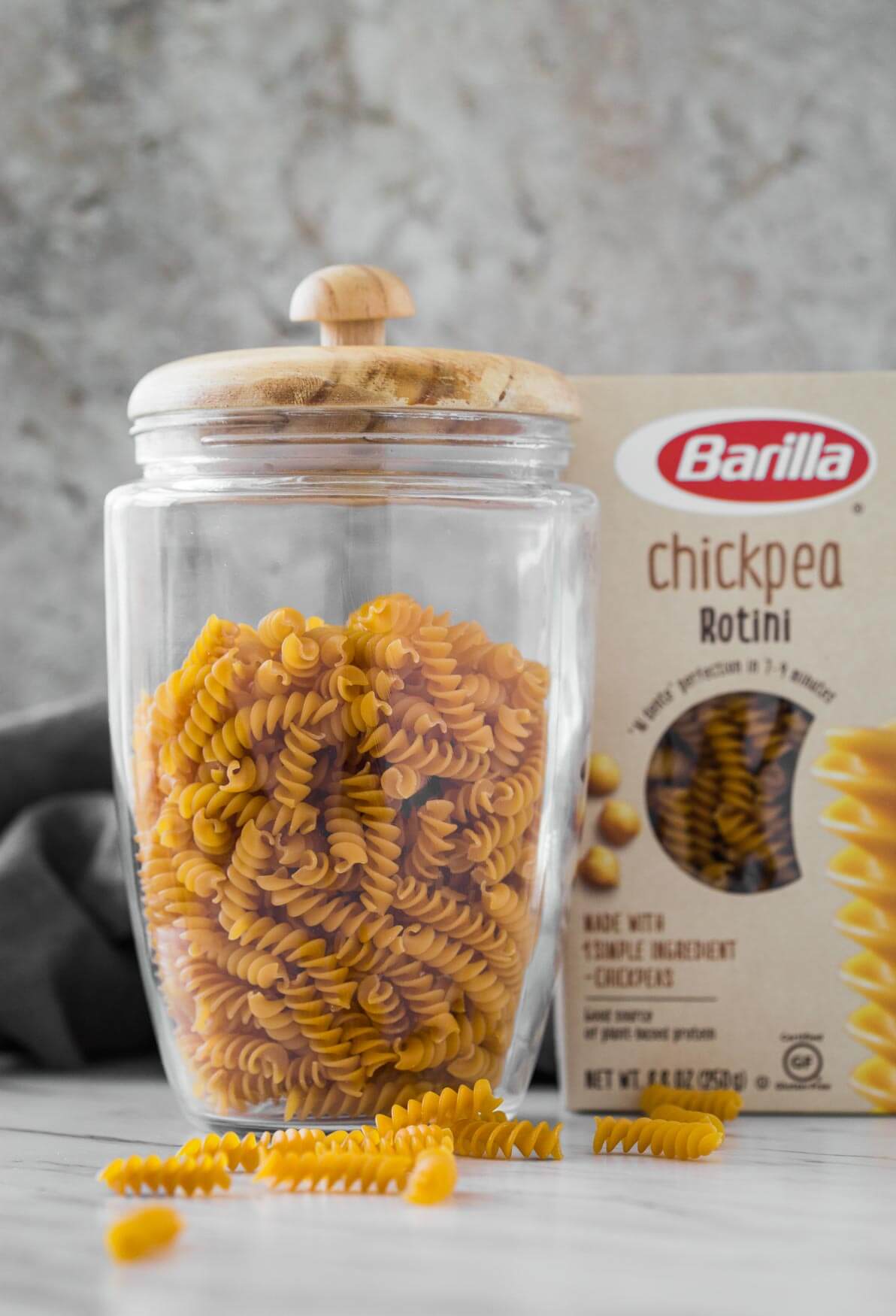 chickpea rotini pasta in a glass jar and in its package