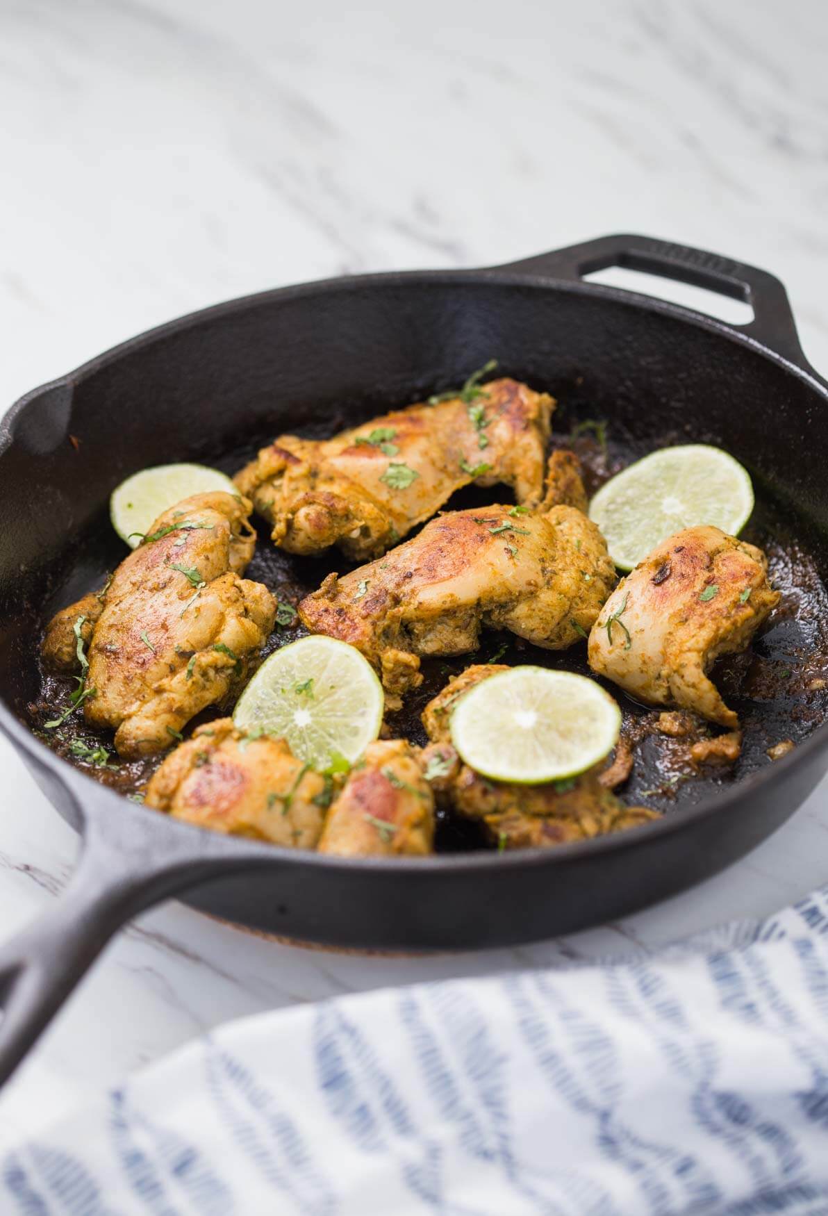 Image of sous vide chicken thighs after searing in cast iron pan.