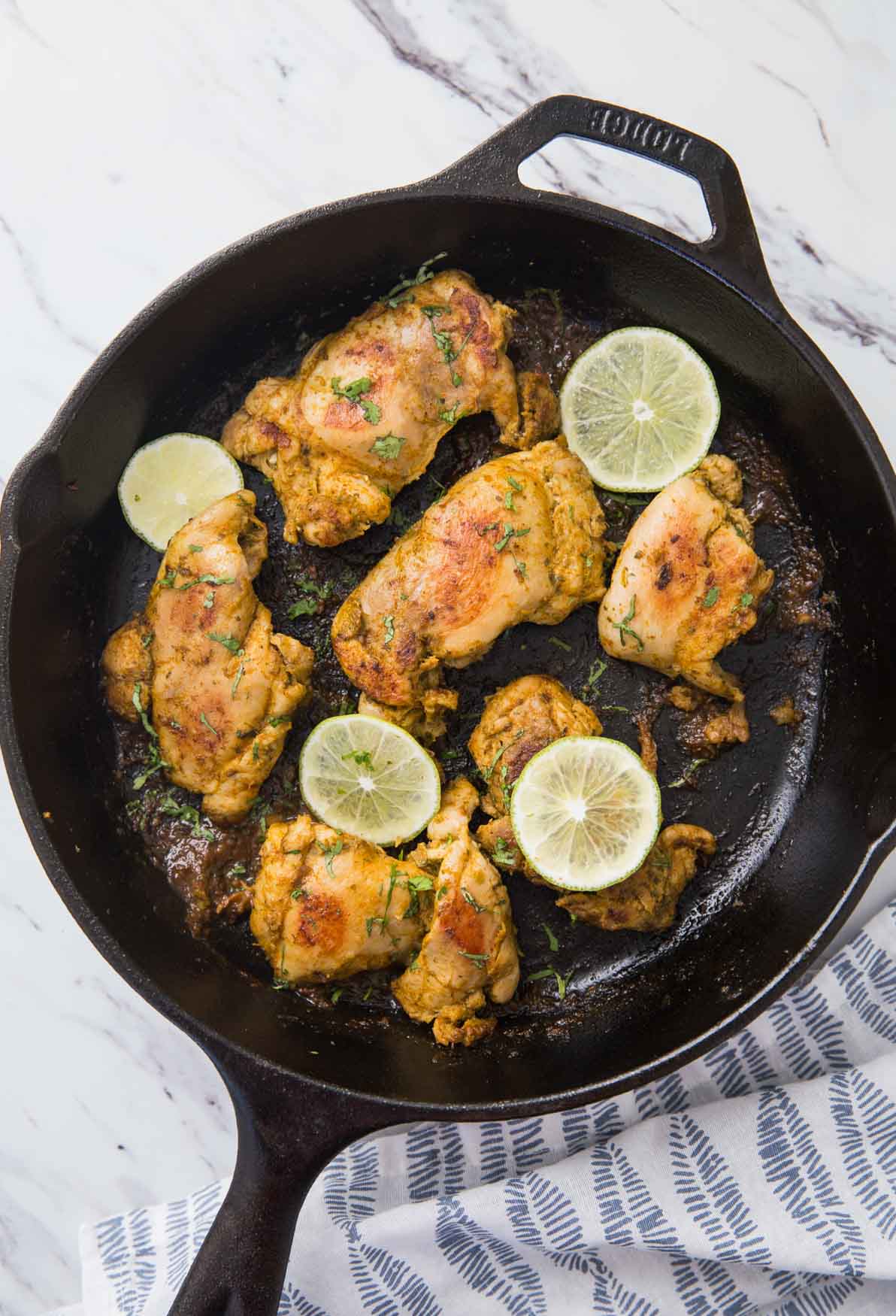 Image of sous vide chicken thighs after searing in cast iron pan.