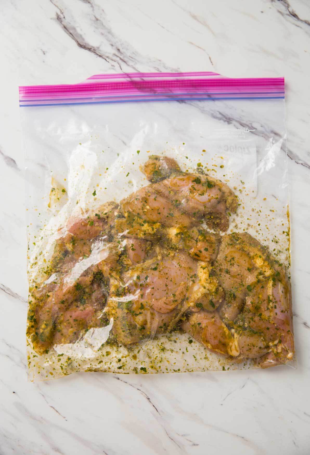 chicken thighs mixed with the cilantro-lime marinade in a zip lock bag for making chicken thighs sous vide.
