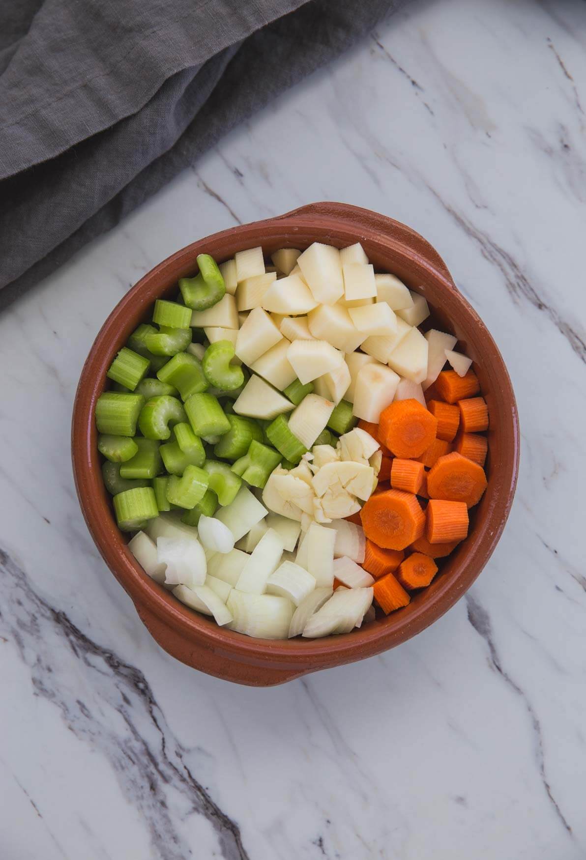 diced vegetables in a shallow bowl for making broccoli soup