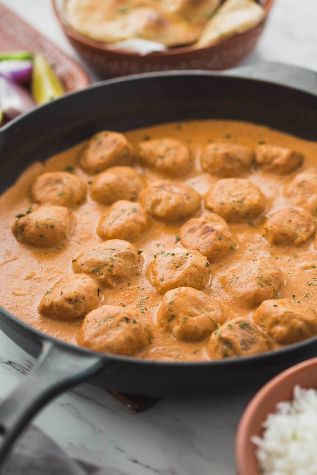 butter chicken masala in a cast iron skillet