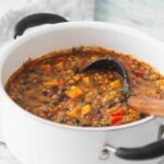 Sweet potato lentil chili prepared in a large pot and is ready to serve.