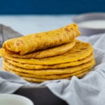 Pumpkin flatbreads stacked in a serving dish with text overlay.