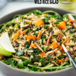 Sweet potato wild rice salad in a serving bowl with serving fork.