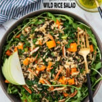 Sweet potato wild rice salad in a serving bowl with serving fork.