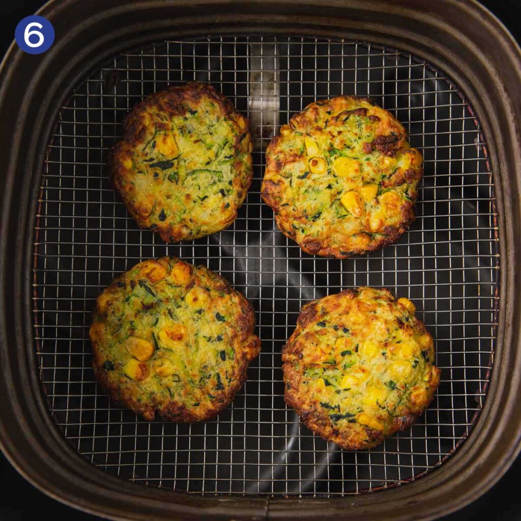 Cooking zucchini and corn fritters in the Air Fryer. 