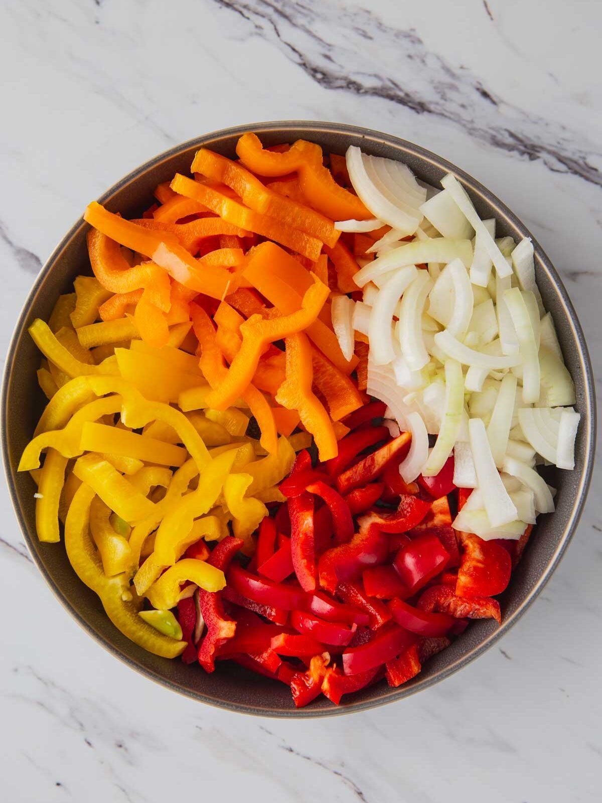 Sliced bell peppers and onion