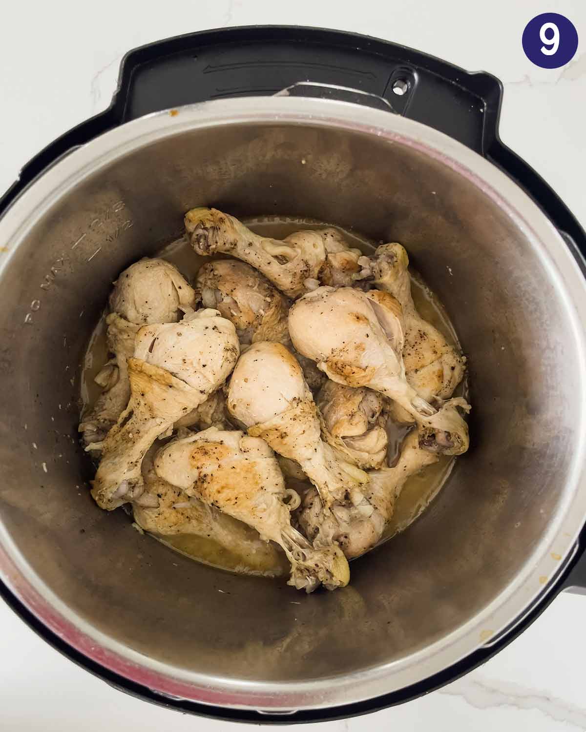 Chicken drumsticks in Instant Pot after pressure cooking.