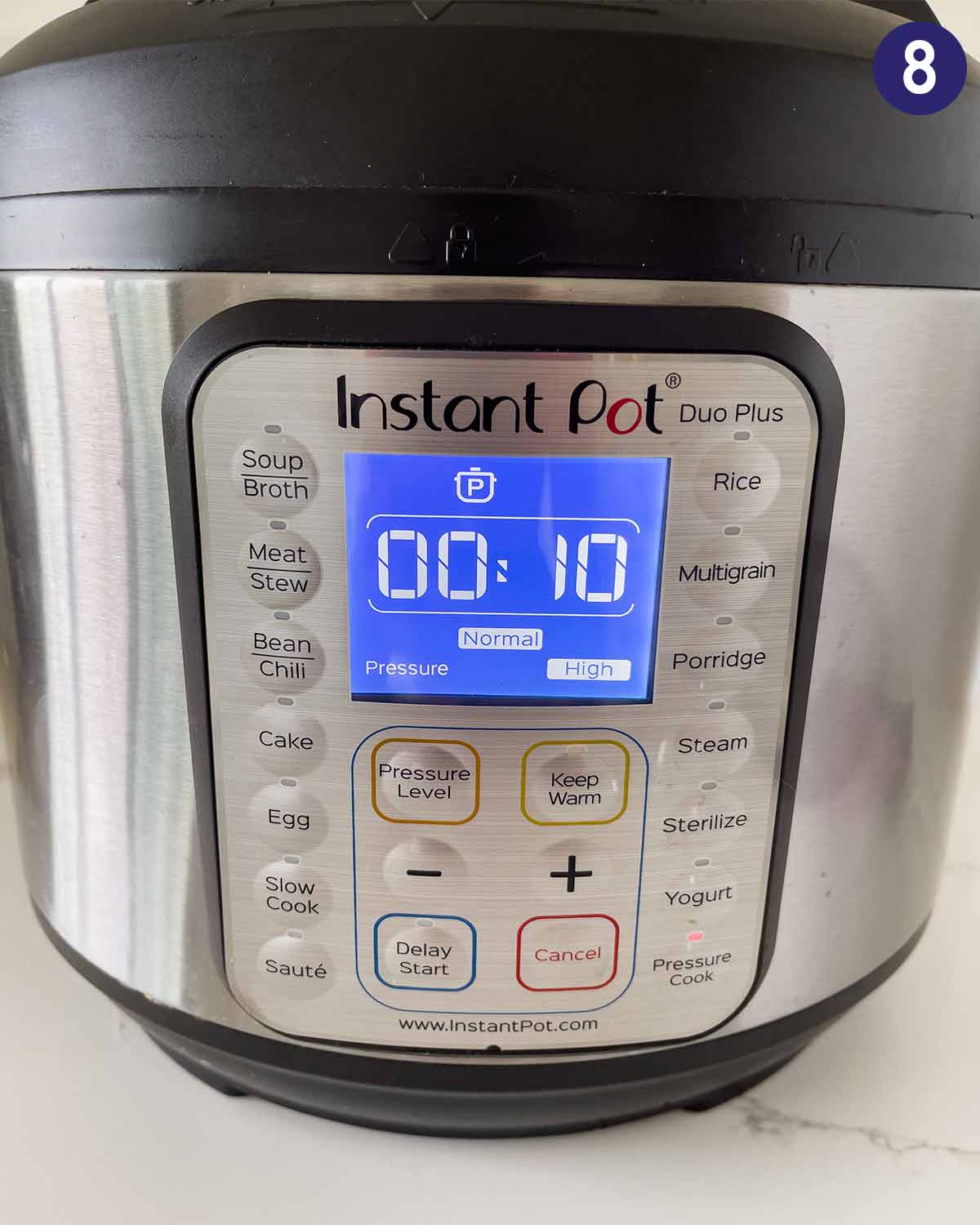 Setting cooking time for Instant Pot chicken legs on manual high pressure.