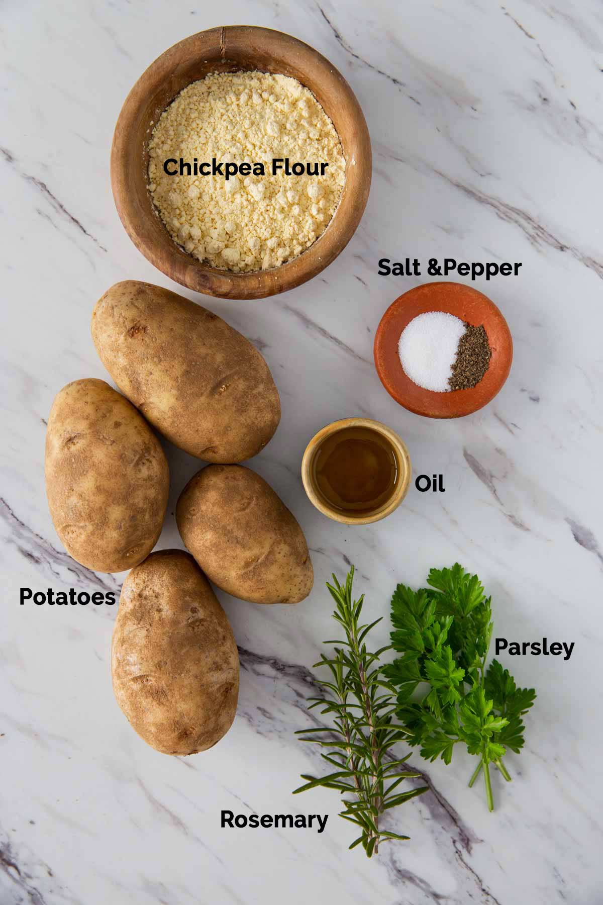 Image of ingredients for making potato fritters laid on a flat surface.