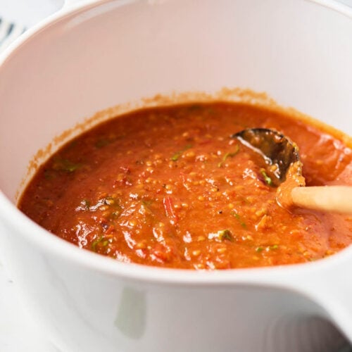 Cherry tomato sauce in a white ceramic saucepan after blending.